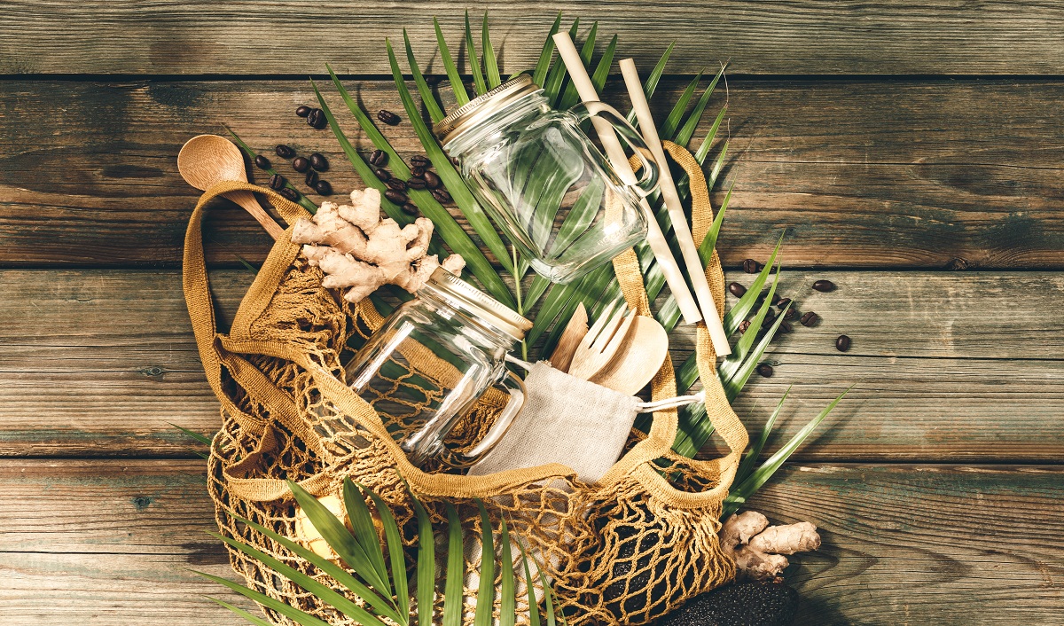 a person smelling two jars of honey, one with a fresh minty aroma, the other with a neutral or chemical scent, focus on facial expression and jars.